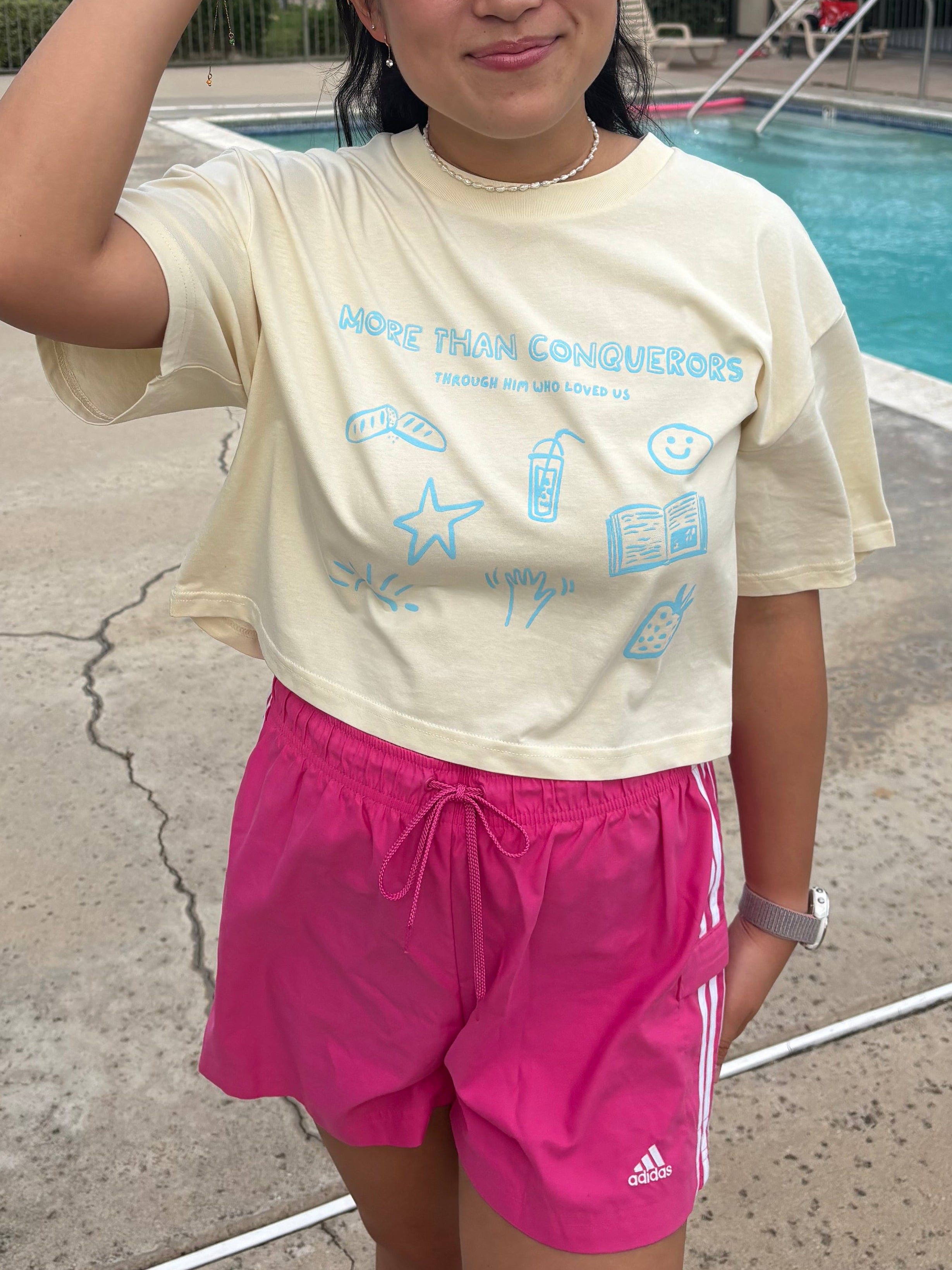 Through Him Who Loved Us Women's Cropped Tee