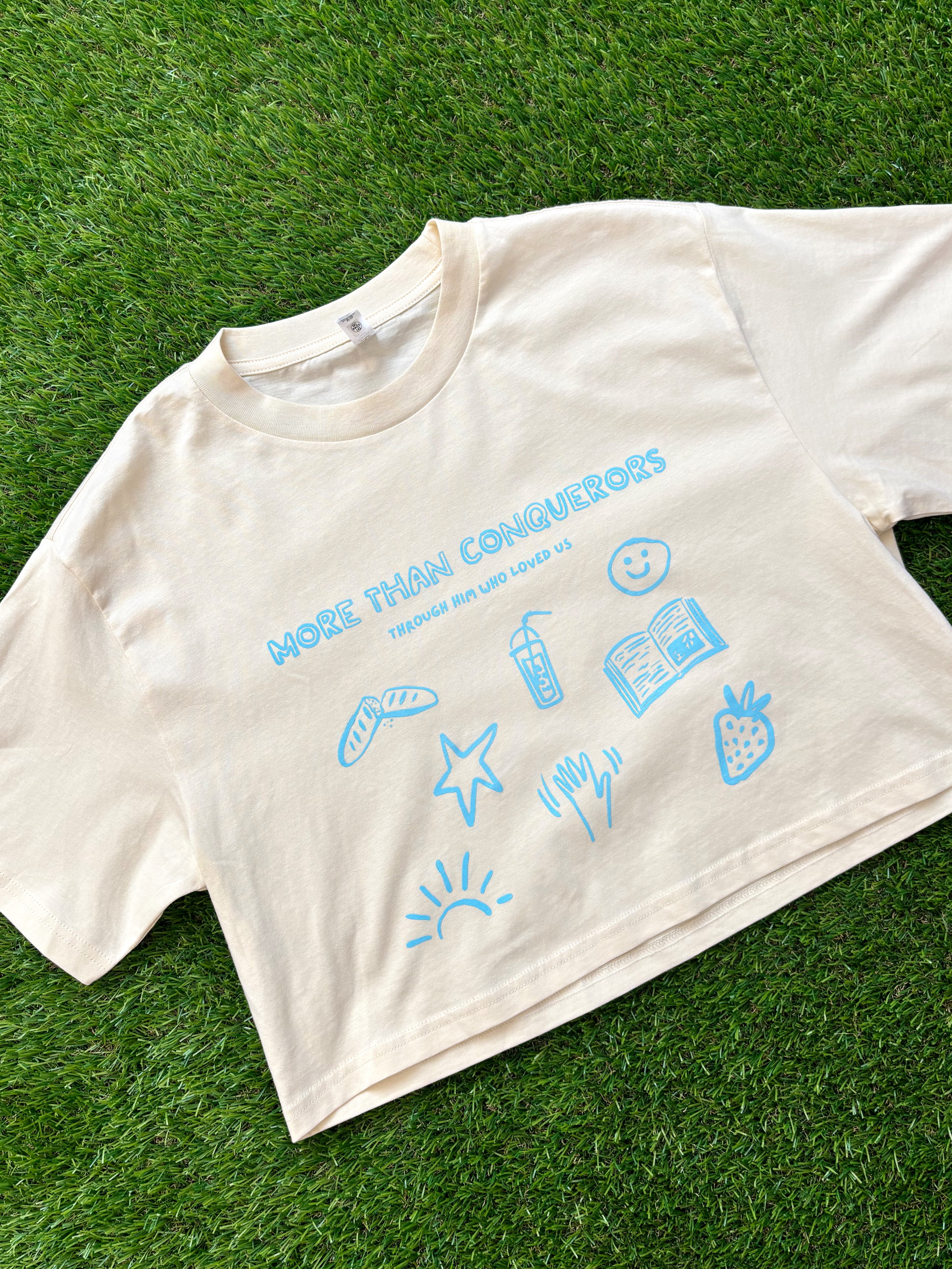 Through Him Who Loved Us Women's Cropped Tee