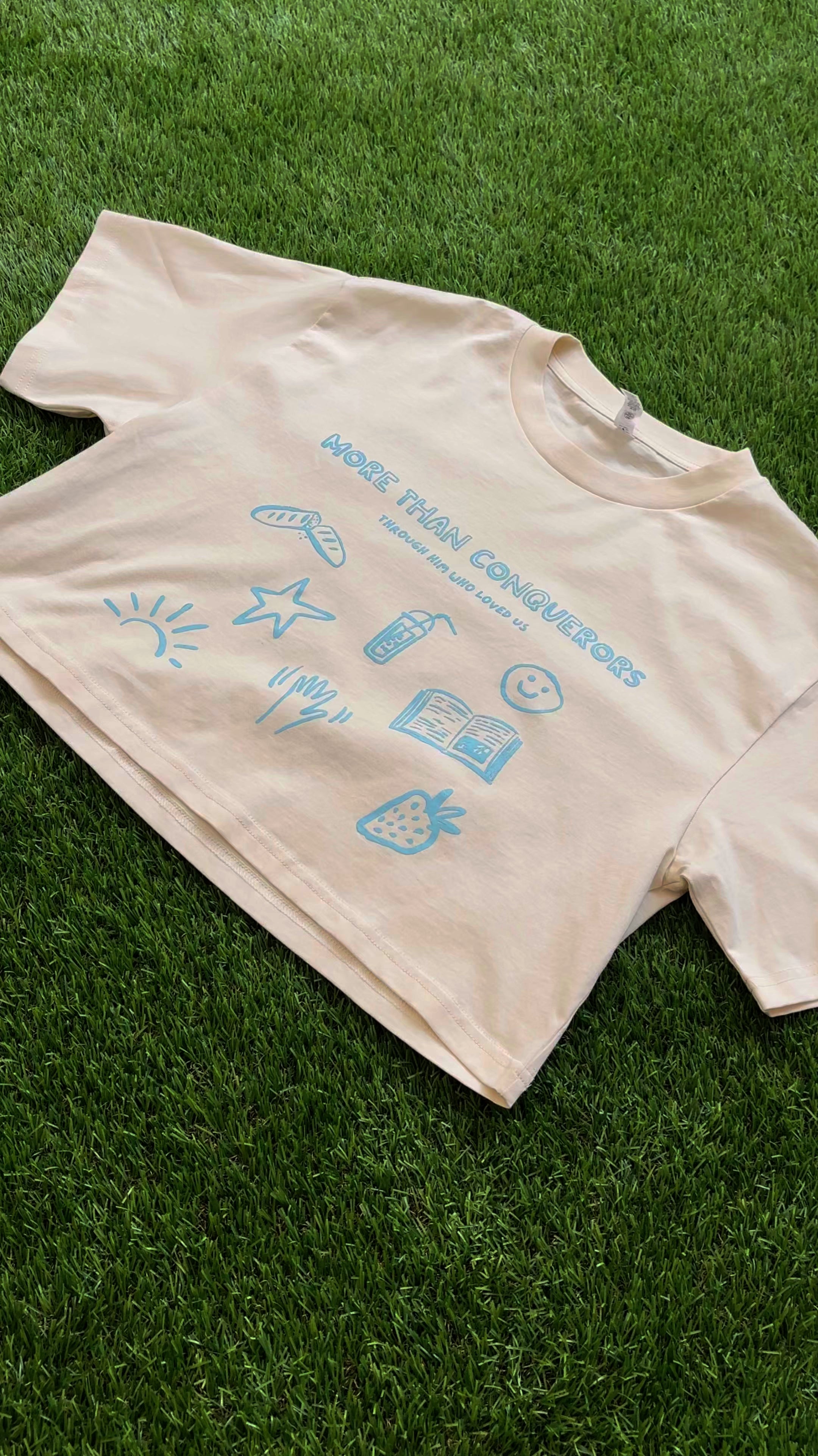 Through Him Who Loved Us Women's Cropped Tee